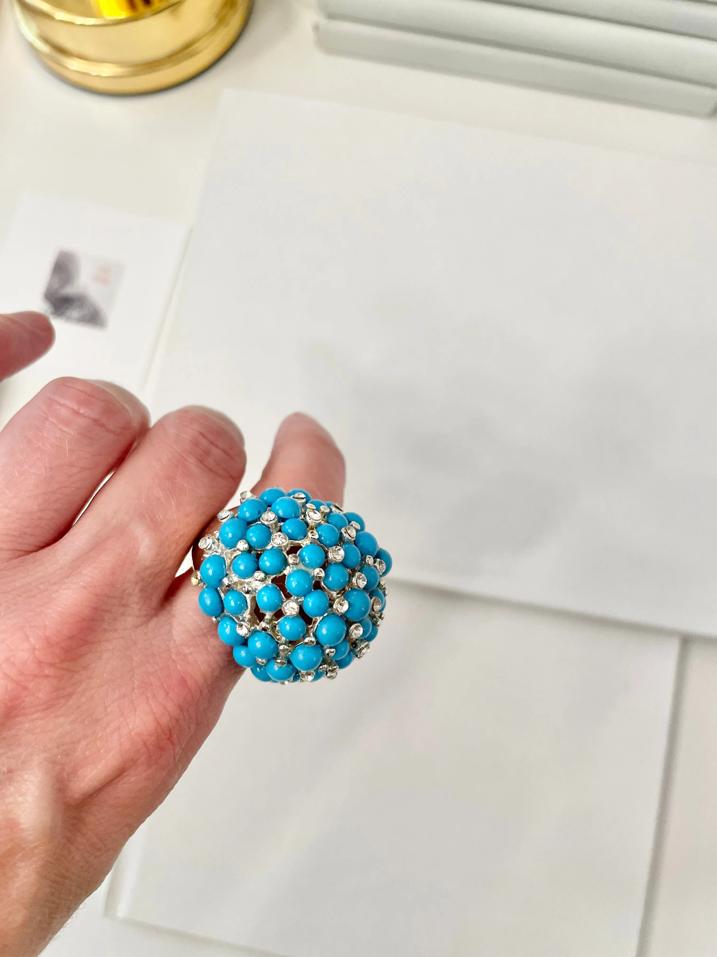 The Happy Hostess and her colorful life...this large faux turquoise cocktail ring is making all ladies gitty!